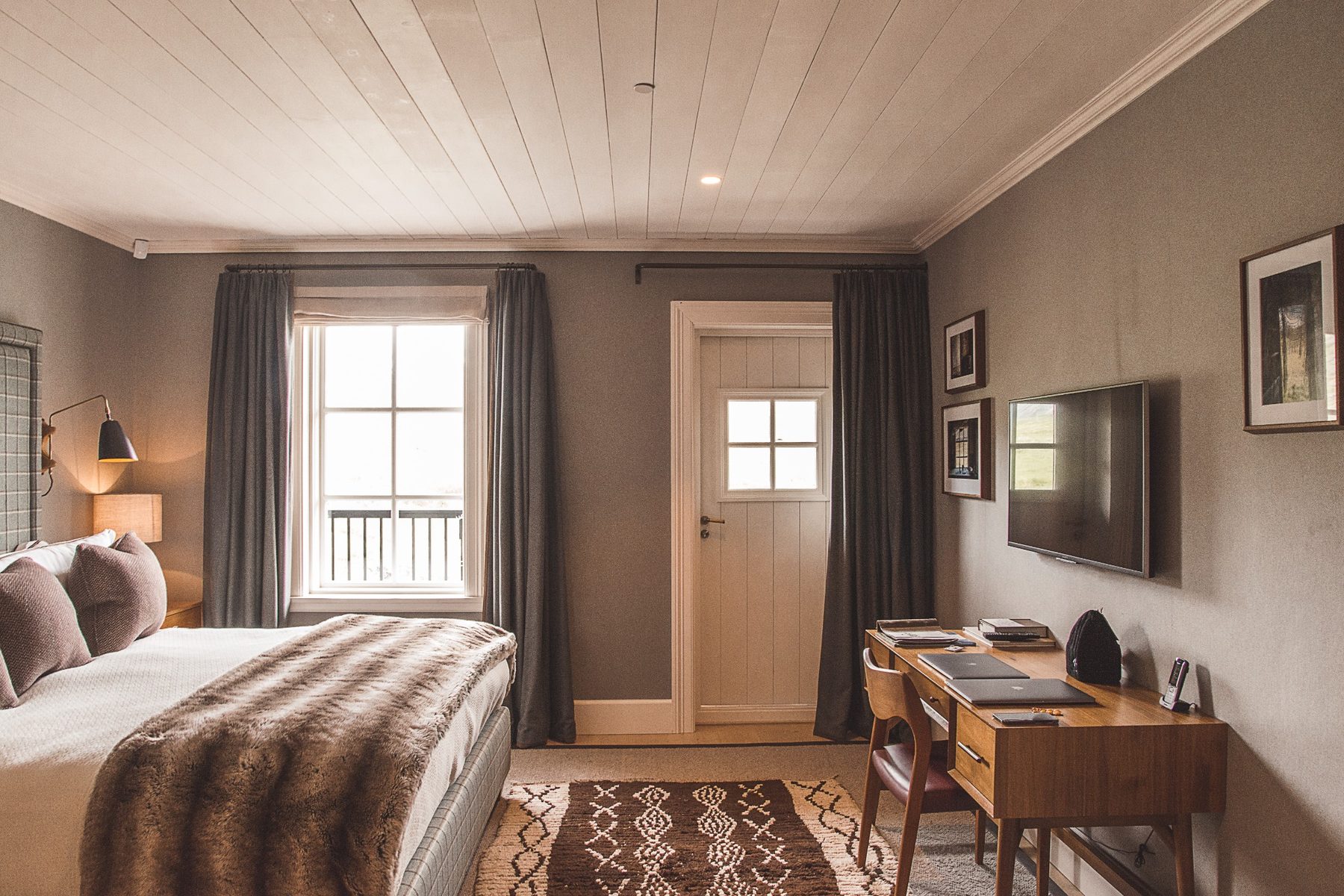 Styled bedroom with warm light and neutral interiors