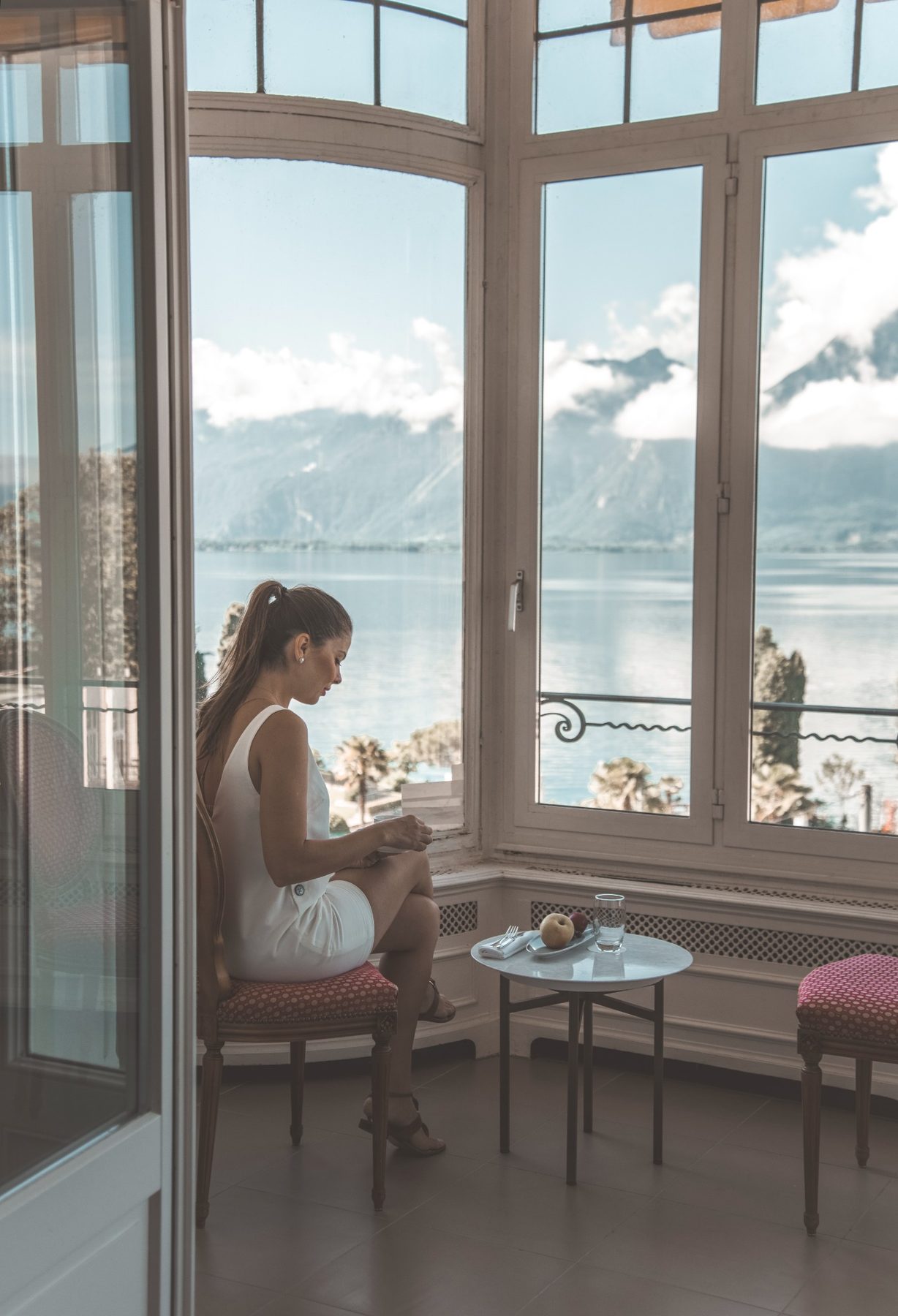 Lifestyle scene by a window with lake view